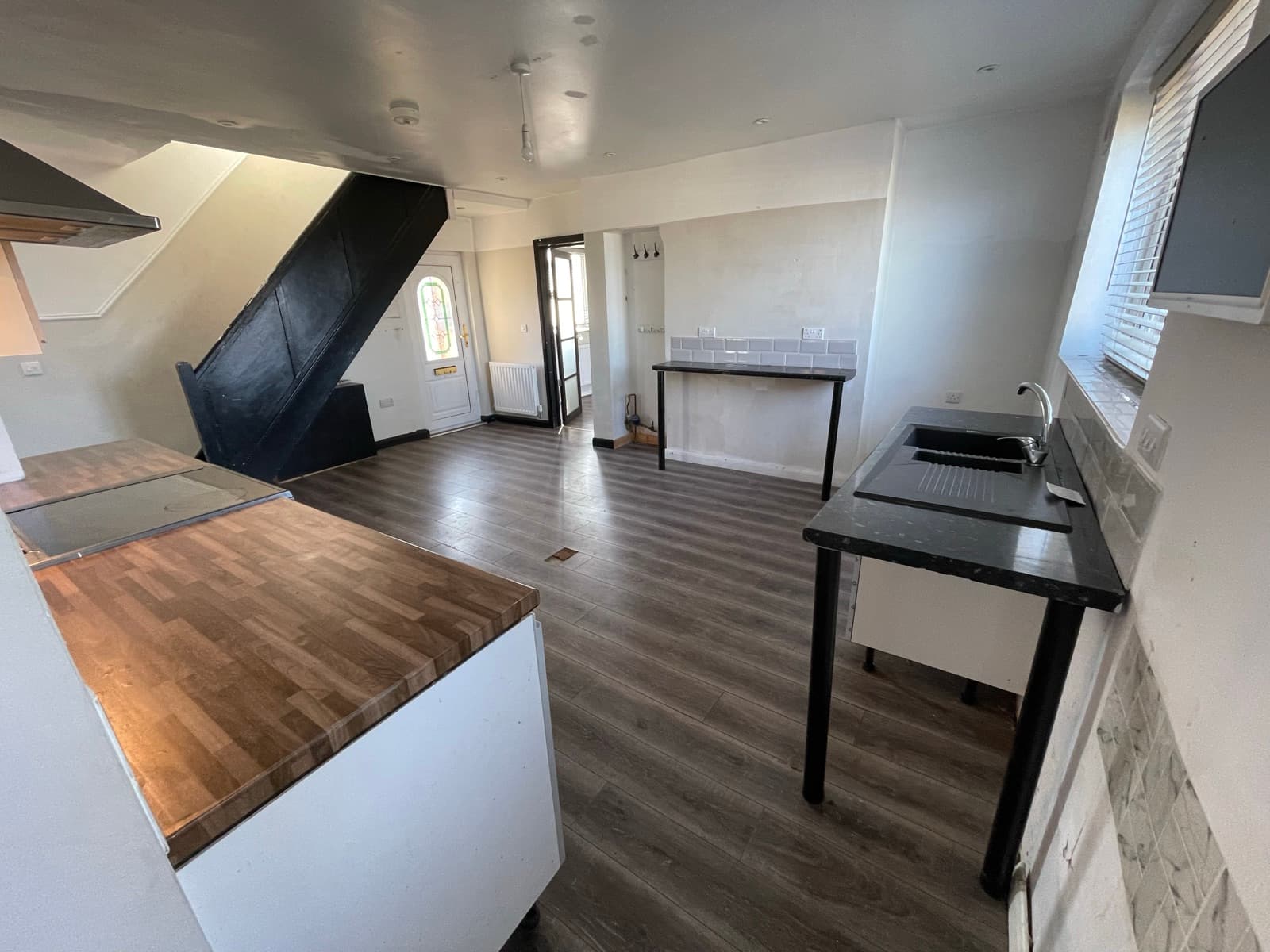 Kitchen and dining area looking towards the front door