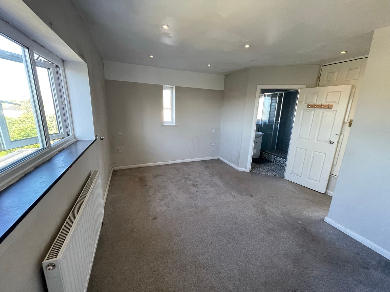 Bedroom with window to the rear