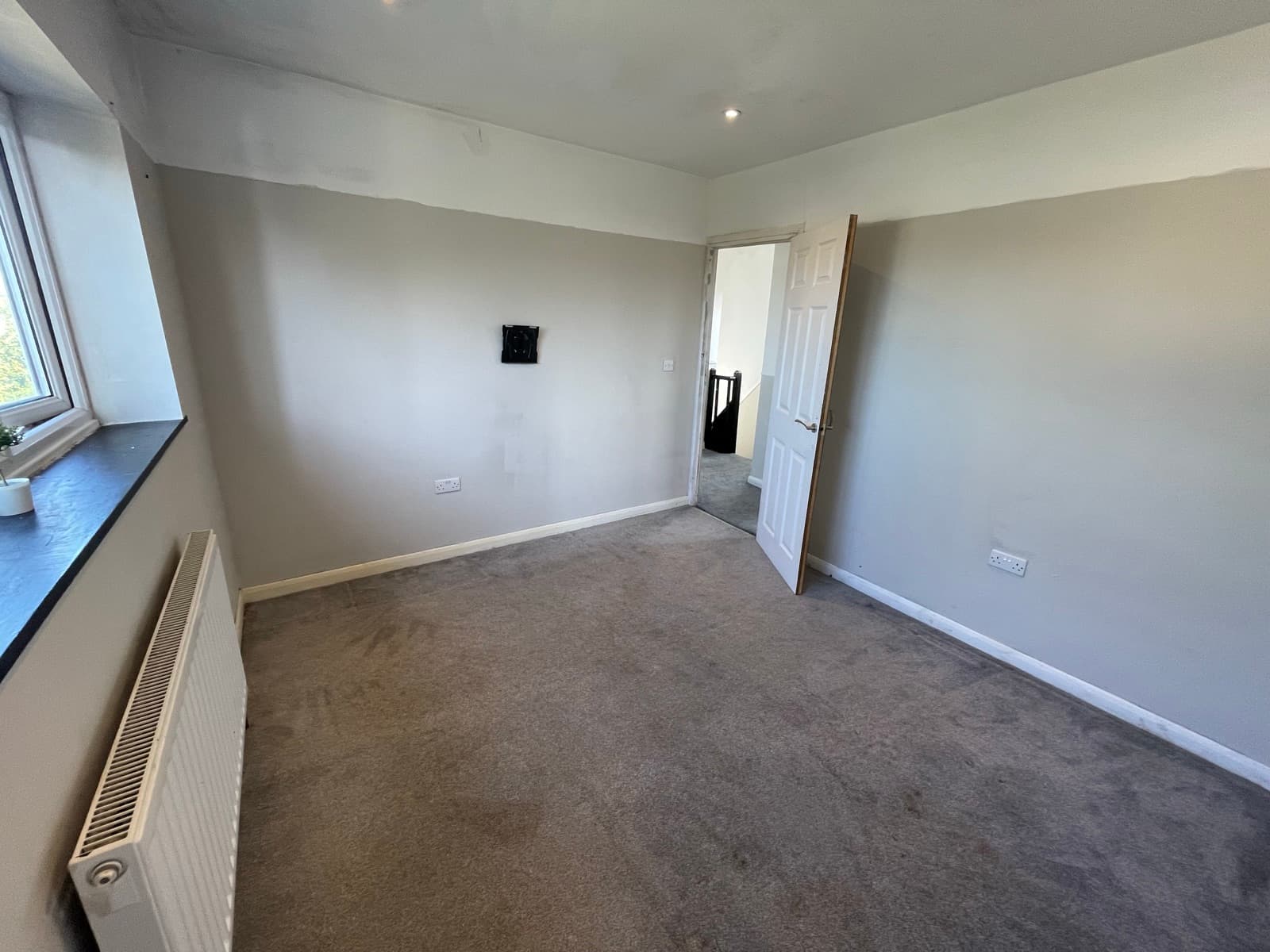 Bedroom 2 with window and door to the landing